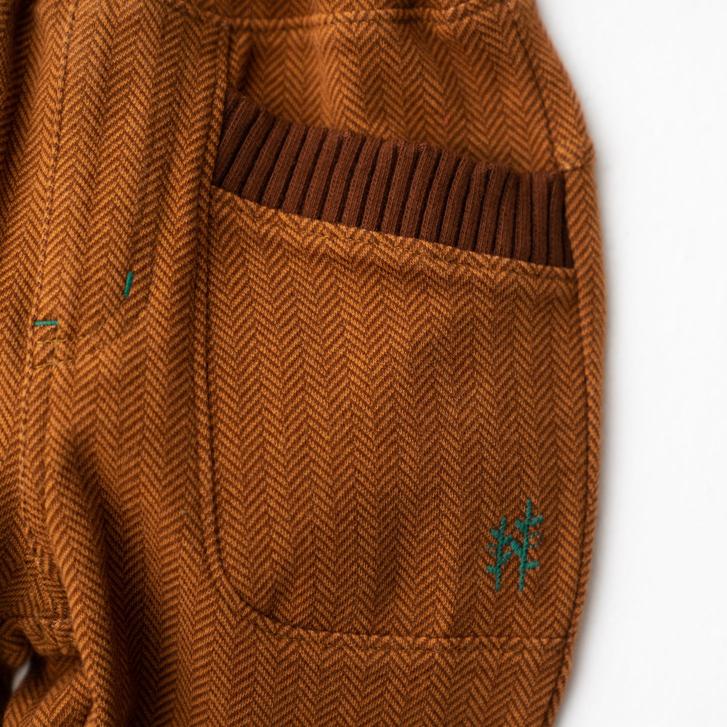 ニットへリンボーンパンツ BROWN